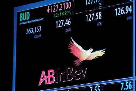 The ticker symbol and trading information for Anheuser-Busch InBev is displayed on a screen on the floor of the New York Stock Exchange (NYSE) in New York City, U.S., July 26, 2016. REUTERS/Brendan McDermid