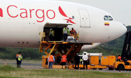 The remains of Gustavo Encina, Paraguayan pilot of the crashed plane that carried the Brazilian team Chapecoense, are brought to the Silvio Pettirossi International Airport in Luque, Paraguay December 2, 2016. REUTERS/Jorge Adorno