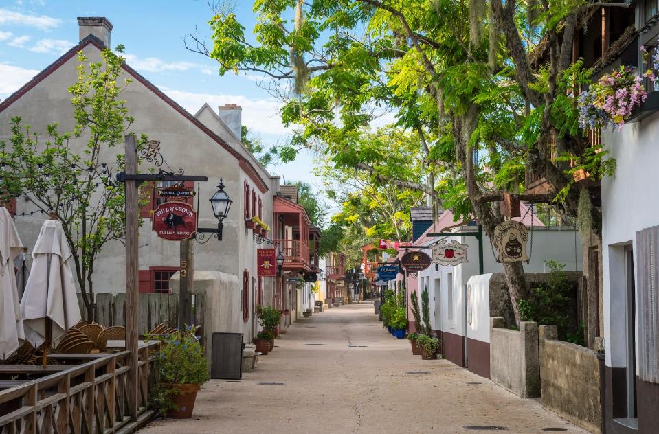 A pedestrianized street lined with shops and attractions in the Historic District of St. Augustine