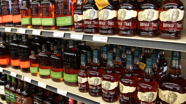 A store shelf with various whiskeys