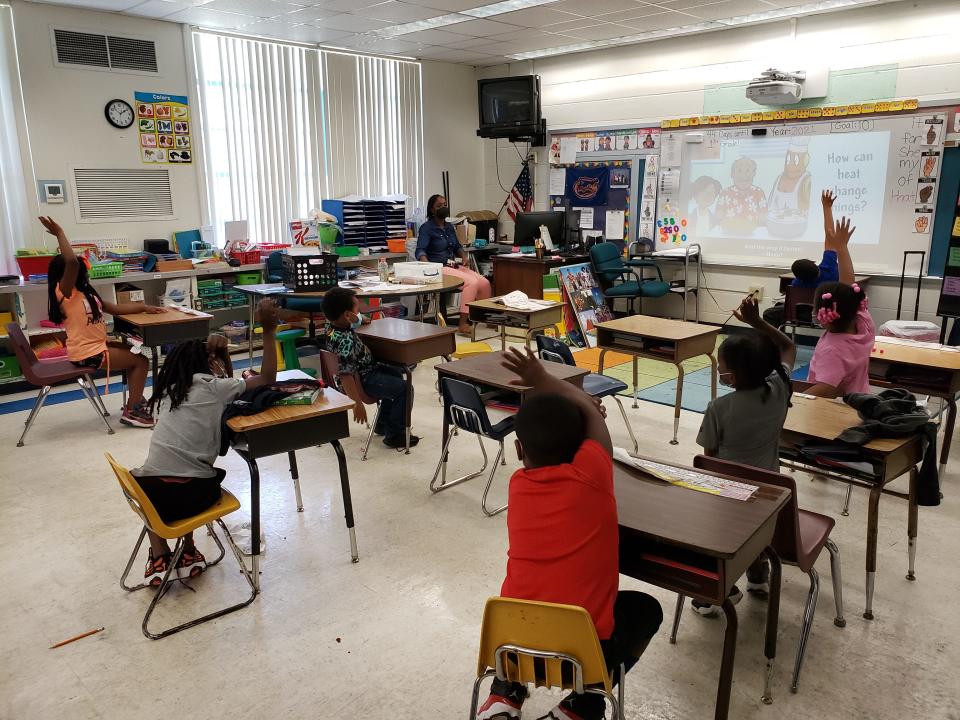 Students answer questions during a science lesson in Amanda Louis' kindergarten class at Williams Elementary School.