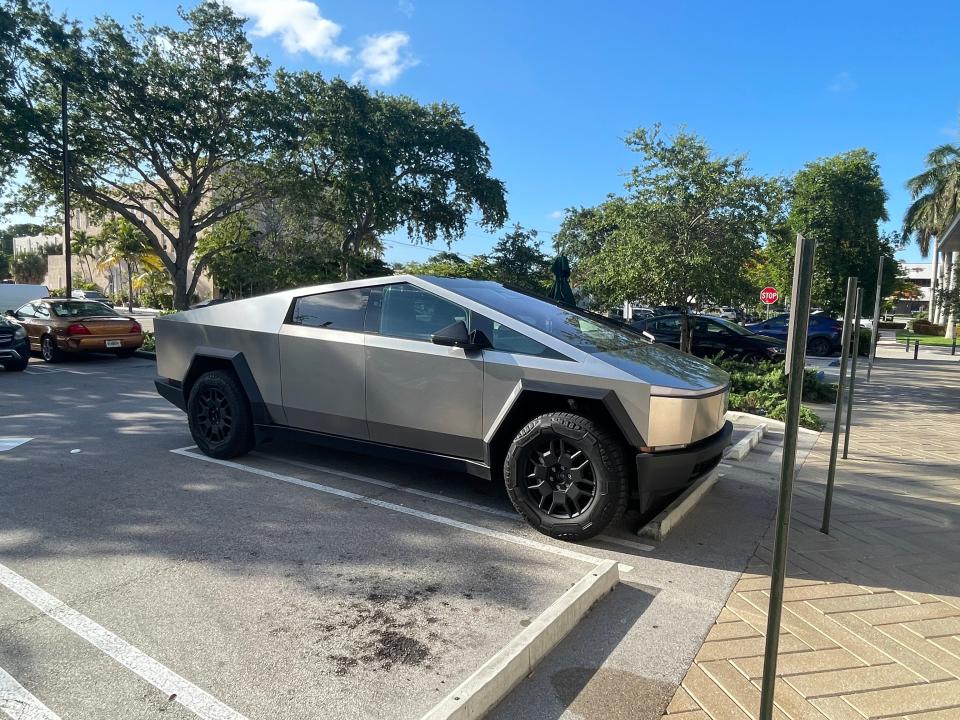 Tesla Cybertruck parked at the Starbucks at the corner of Belvedere Road and U.S. 1 in West Palm Beach on Tuesday, June 18, 2024. The electic vehicle, which drew dozens of gawkers and onlookers, belongs to West Palm Beach personal injury attorney Calvin Robinson.