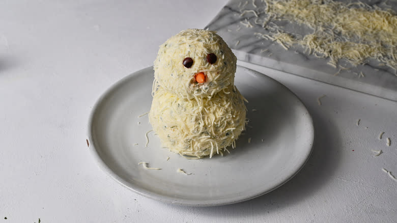 snowman cheese ball on plate