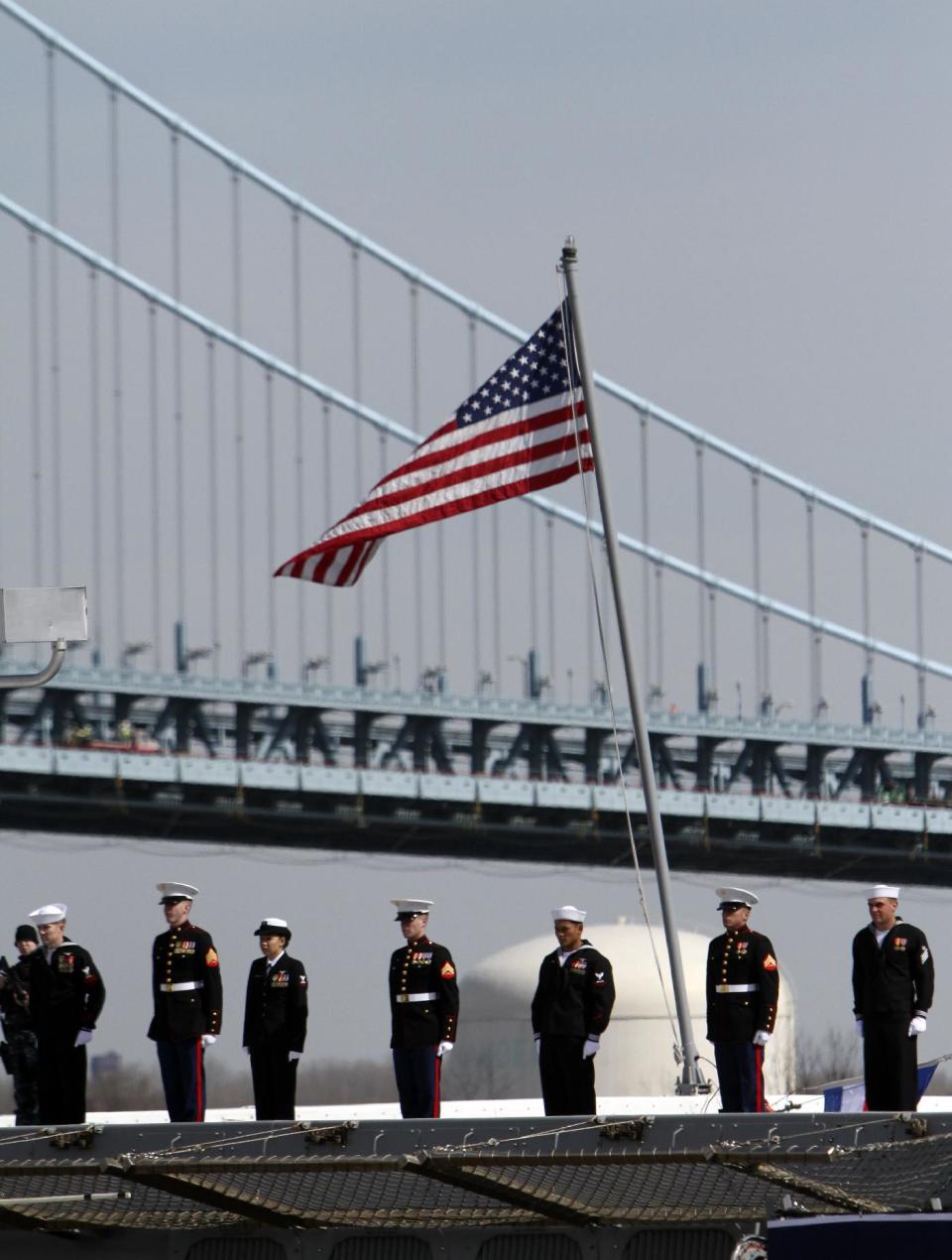 Crew members line the rails during a commissioning ceremony for the USS Somerset (LPD 25) Saturday Mar. 1, 2014, in Philadelphia. The USS Somerset is the ninth San Antonio-class amphibious transport dock and the third of three ships named in honor of those victims and first responders of the attacks on the World Trade Center and the Pentagon. The ship is named for the county where Flight 93 crashed after being hijacked on Sept. 11, 2001. (AP Photo/ Joseph Kaczmarek)