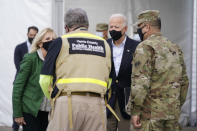 President Joe Biden and first lady Jill Biden arrive at a FEMA COVID-19 mass vaccination site at NRG Stadium, Friday, Feb. 26, 2021, in Houston. (AP Photo/Patrick Semansky)