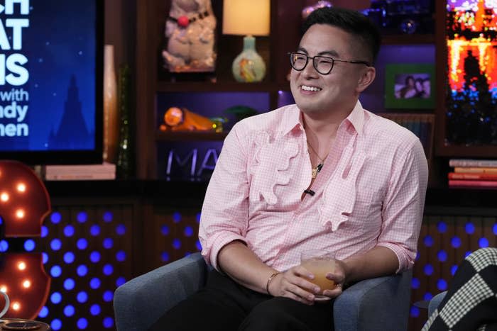 Bowen Yang smiling on "WATCH WHAT HAPPENS LIVE WITH ANDY COHEN"