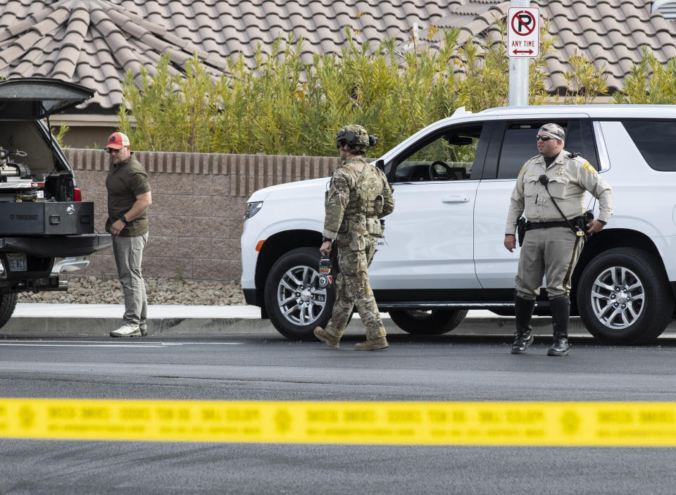 A SWAT team arrives where Las Vegas police are assisting the Federal Bureau of Investigation in a barricade and shooting situations in northwest Las Vegas on Thursday, March 3, 2022, in Las Vegas. Beasley, a longtime Las Vegas attorney was indicted Wednesday, March 29, 2023 on federal charges that he orchestrated a $460 million Ponzi scheme spanning multiple states, from Nevada and Utah to California and Arizona.(Bizuayehu Tesfaye/Las Vegas Review-Journal via AP)