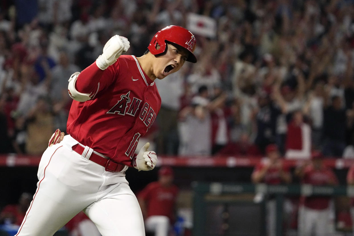 Angels star Shohei Ohtani celebrates as he rounds first after hitting a two-run home run in the seventh inning Monday against the New York Yankees in Anaheim, California. (AP Photo/Mark J. Terrill)