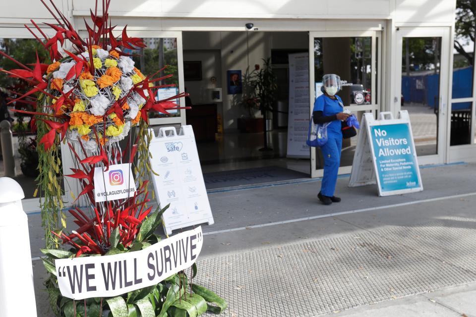 A floral arrangement outside Jackson Memorial Hospital in Miami expresses the determination to weather a rapid rise in coronavirus cases in Florida.