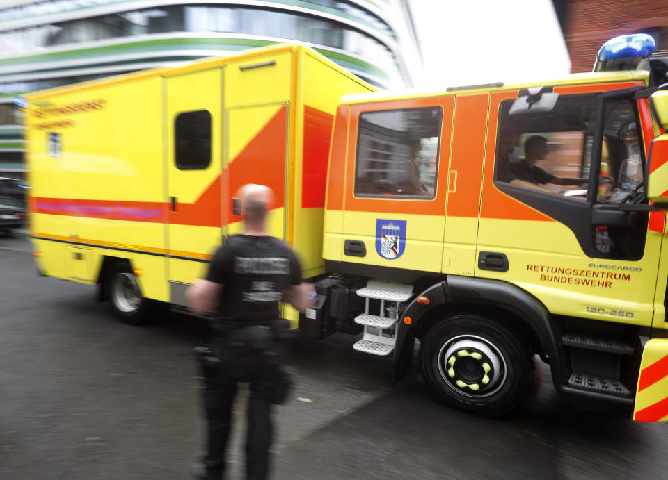 An ambulance which is believed to transport Alexei Navalny arrives at the Charite hospital in Berlin, Germany, Saturday, Aug.22, 2020. The dissident who is in a coma after a suspected poisoning has been transferred from the Siberian city of Omsk. Navalny is flown to Germany to receive treatment. (AP Photo/Markus Schreiber)