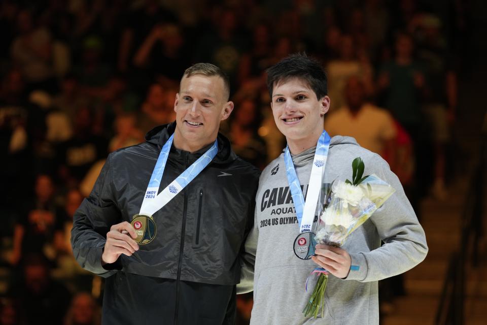 Caeleb Dressel and Thomas Heilman celebrate after the Men's 100 butterfly finals Saturday, June 22, 2024, at the US Swimming Olympic Trials in Indianapolis. (AP Photo/Michael Conroy)