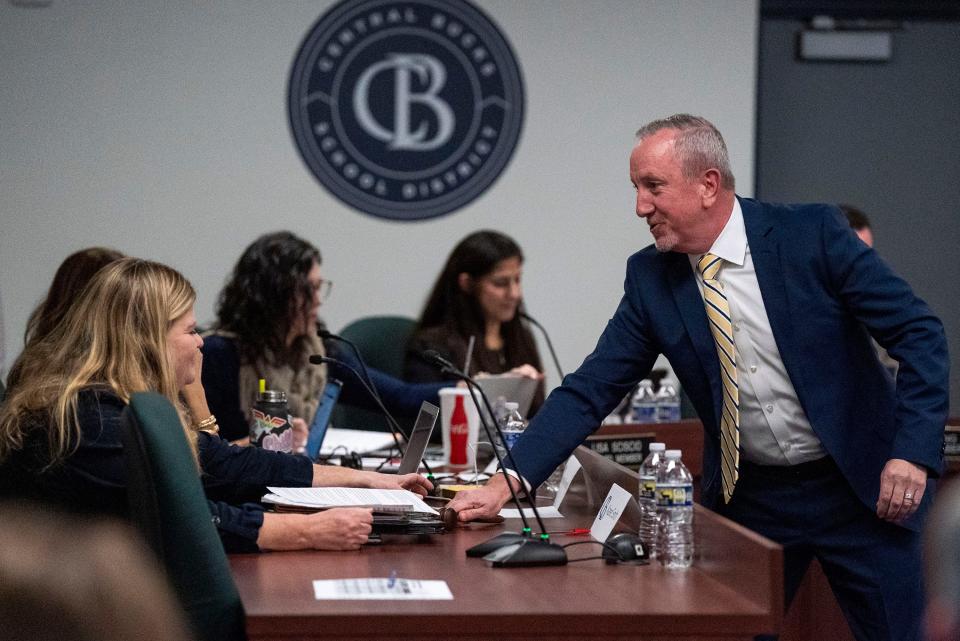 Newly-elected Board President Karen Smith, left, receives the gavel from Assistant Superintendent for Secondary Education Dr. Charles Malone, right, at the Central Bucks School District Board re-org in Doylestown on Monday, Dec. 4, 2023.

[Daniella Heminghaus | Bucks County Courier Times]