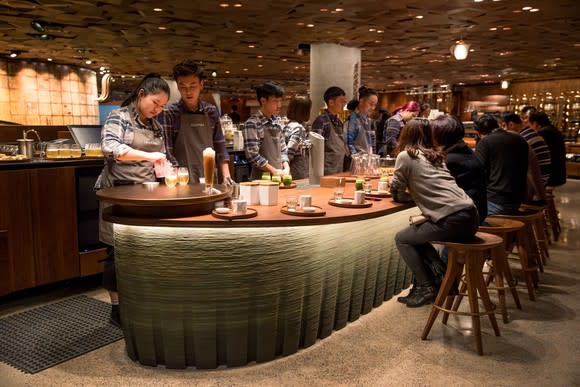 People gather around a bar in Starbucks' Shanghai Roastery.