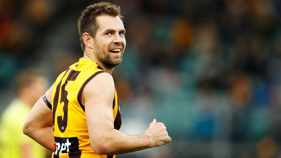 Luke Hodge is pictured playing for Hawthorn.