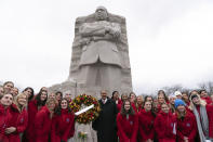 Martin Luther King III, center, poses with a group of students during the annual Martin Luther King, Jr. Wreath Laying Ceremony at the Martin Luther King Jr. Memorial in Washington, Monday, Jan. 15, 2024. ( AP Photo/Jose Luis Magana)
