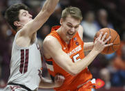 Syracuse's Buddy Boeheim (35) drives on Virginia Tech's Hunter Cattoor (0) during the first half of an NCAA college basketball game in Blacksburg Va., Saturday, Jan. 18 2020. (Matt Gentry/The Roanoke Times via AP)