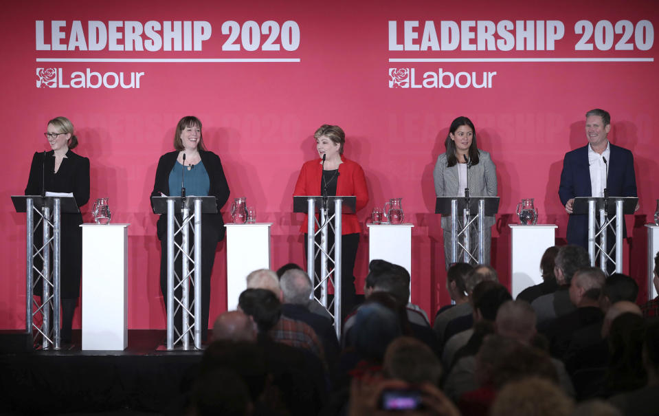 From left, Labour Members of Parliament, Rebecca Long-Bailey, Jess Phillips, Emily Thornberry, Lisa Nandy and Keir Starmer stand on the stage, during the first Labour leadership hustings at the ACC Liverpool, in Liverpool, England, Saturday, Jan. 18, 2020. (Danny Lawson/PA via AP)