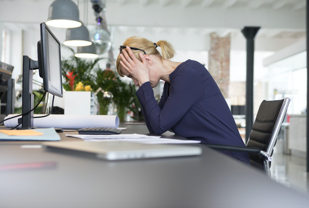 Workplace stress is a huge factor among UK workers (Picture: Rex)