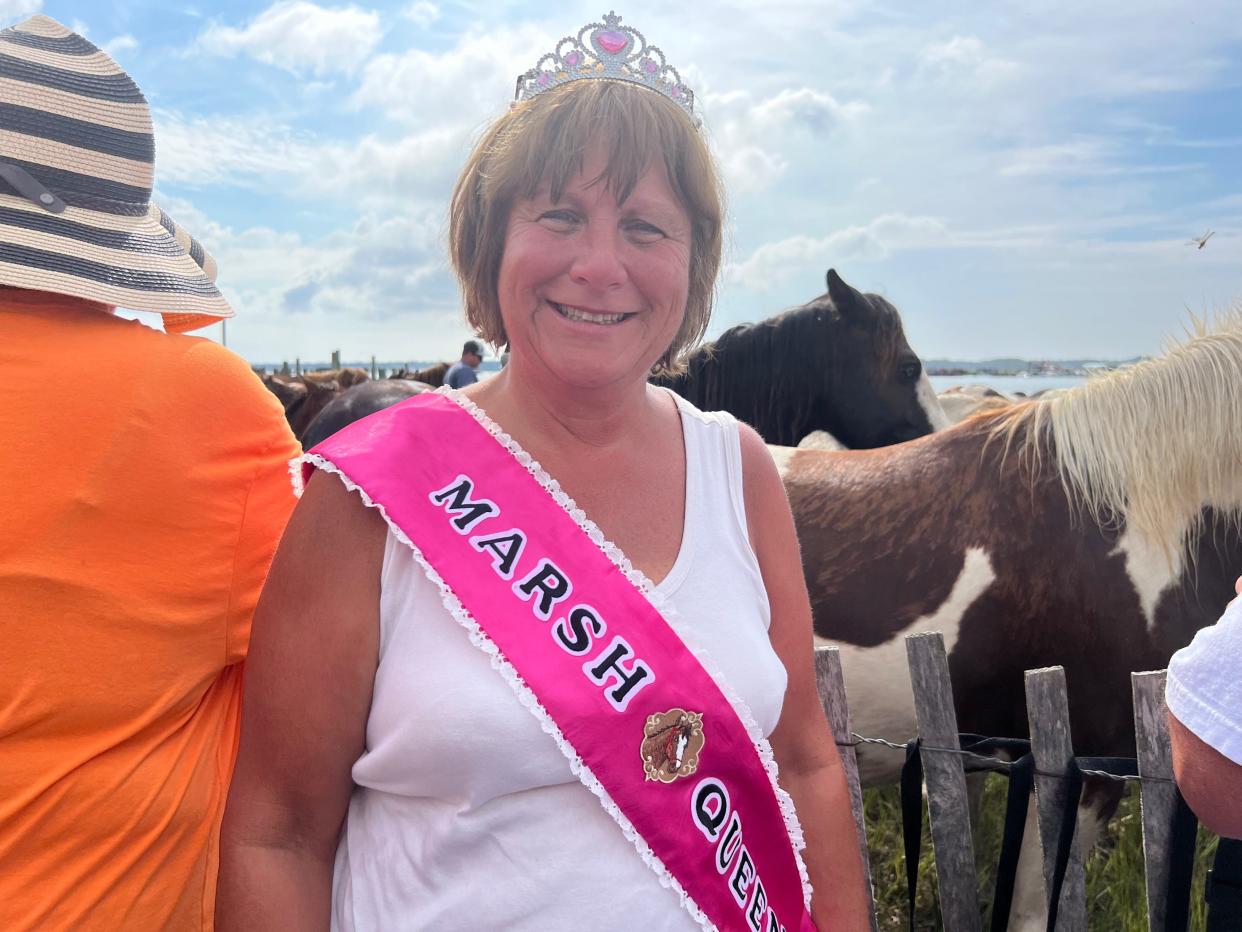 Kim Fromal, 60, calls herself the “Marsh Queen.” She has attended Pony Penning for 34 years. Fromal says she is  the very first to arrive at the Pony Swim event, hence her moniker.