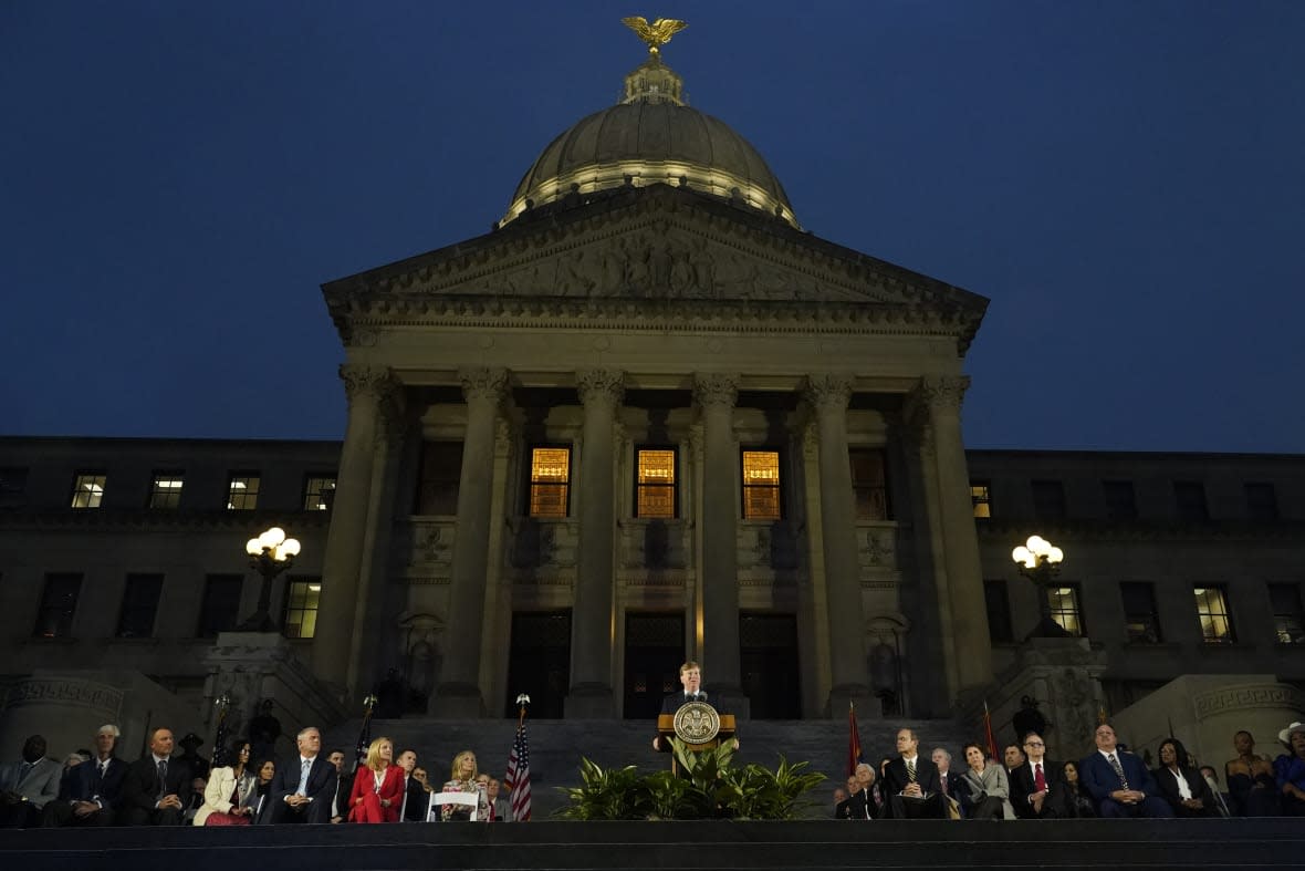 Mississippi Gov. Tate Reeves, center, speaks during his State of the State address on the steps of the state Capitol in Jackson, Miss., Monday, Jan. 30, 2023. (AP Photo/Rogelio V. Solis, File)