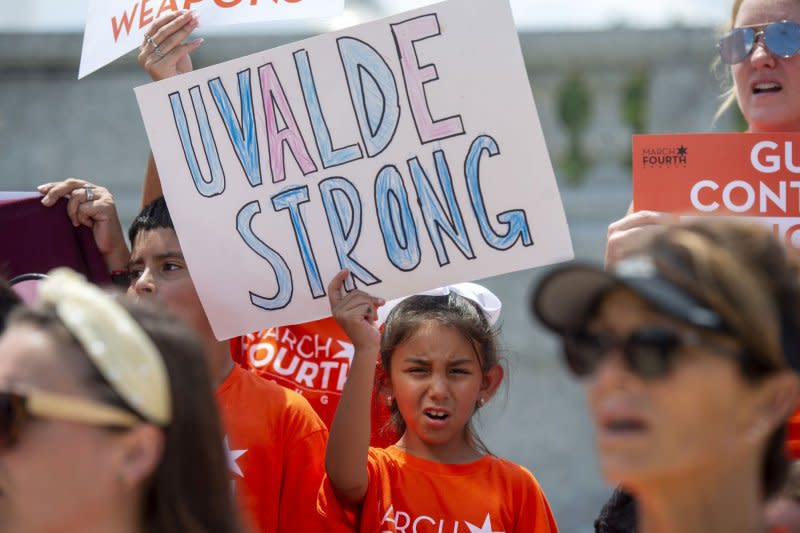 A young girl participating in the March Fourth rally to ban assault weapons holds a "Uvalde Strong" sign outside the Senate office buildings at the U.S. Capitol in Washington, D.C., on July 13. On May 24, 2022, a mass shooting at a Uvalde, Texas, elementary school left 19 students and two adults dead. Law enforcement officers fatally shot the gunman. File Photo by Bonnie Cash/UPI