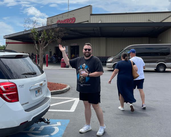 <p>Courtesy of Emma Blevins</p> Clint Blevins outside of Costco on his birthday.
