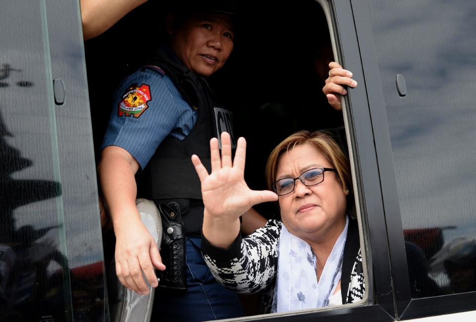 Senator Leila De Lima waves to her supporters after appearing at a court in Muntinlupa City, suburban Manila on February 24, 2017.