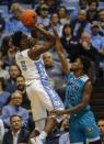 Dec 5, 2018; Chapel Hill, NC, USA; North Carolina Tar Heels forward Nassir Little (left) shoots over North Carolina-Wilmington Seahawks guard Jay Estime' (12) in the first half at Dean E. Smith Center. Nell Redmond-USA TODAY Sports