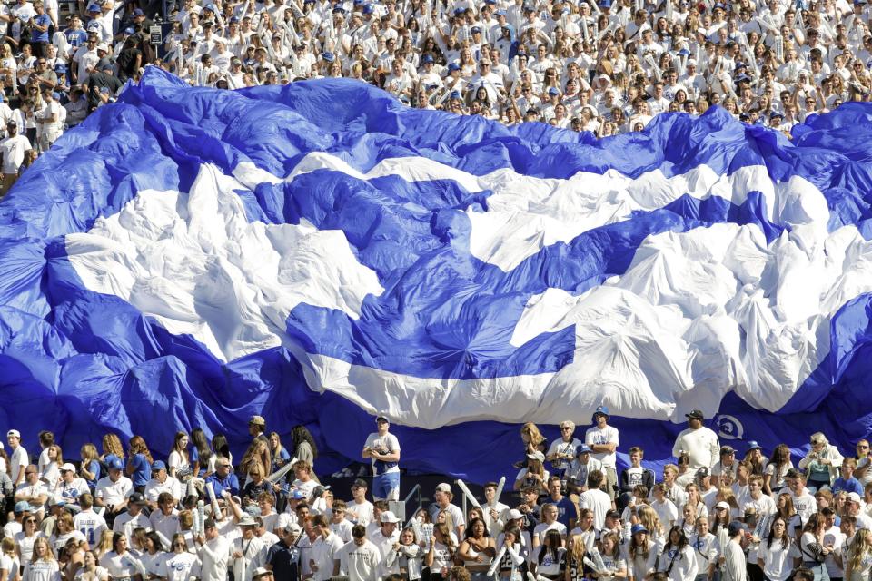 Fans in the student section hold up a BYU banner&nbsp;during a football game at LaVell Edwards Stadium in Provo, Oct. 15, 2022.