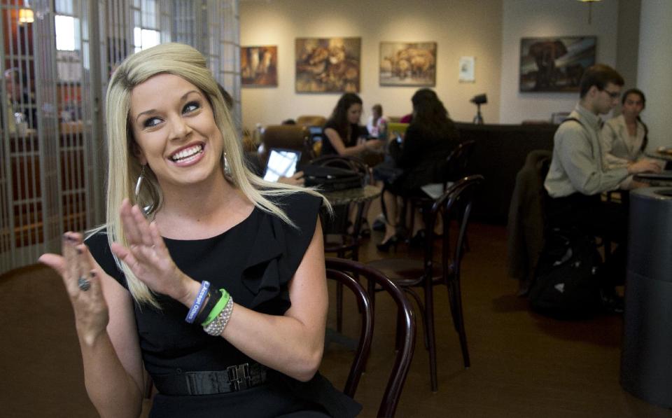 In this photo taken August 19, 2013, Miss America 2011, Teresa Scanlan, who is now attending Patrick Henry College in Purcellville, Va., speaks to the Associated Press during an interview at the campus coffee shop. To an outsider the bikini-clad, Vegas-savvy Scanlan, mixing with fellow students at ultra-conservative Patrick Henry College, that caters to homeschoolers and regulates the private affairs of its students, may be a jarring contrast. But it’s proved a good fit for Scanlan. (AP Photo/Manuel Balce Ceneta)