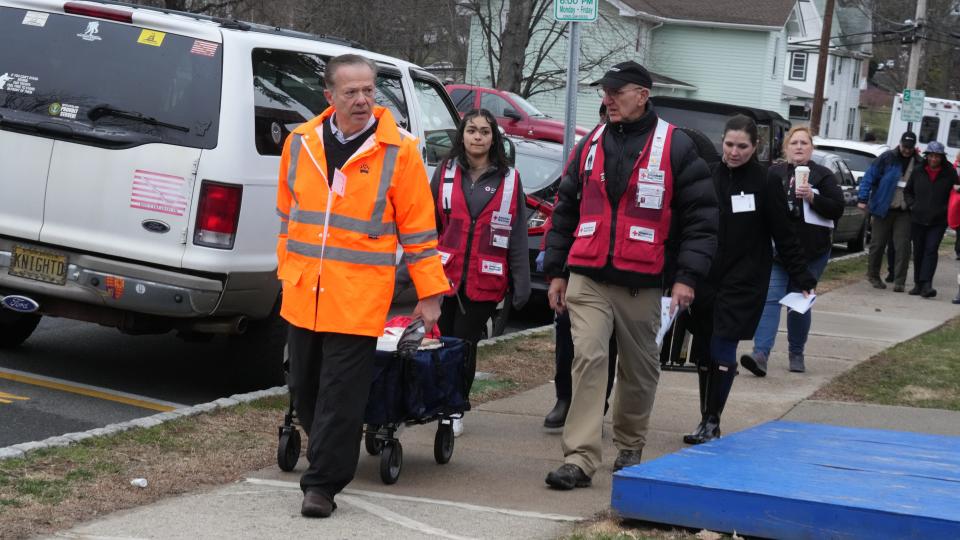 Ed Susco, member of the Board of Directors for the Northen NJ Chapter of the Red Cross leads one of several groups to help check and install smoke detectors. The Dover fire department and the New Jersey Red Cross organized volunteers then went door to door in selected Dover neighborhoods to offer free smoke detector inspections and installations on March 25, 2023.