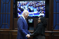 FILE - President Joe Biden talks with Supreme Court nominee Judge Ketanji Brown Jackson as they watch the Senate vote on her confirmation from the Roosevelt Room of the White House in Washington, April 7, 2022. The first Black woman confirmed for the Supreme Court, Jackson, is officially becoming a justice. Jackson will be sworn as the court’s 116th justice at midday Thursday, June 30, just as the man she is replacing, Justice Stephen Breyer, retires. (AP Photo/Susan Walsh, File)