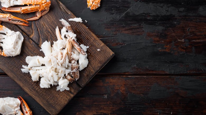 crab meat on wooden board