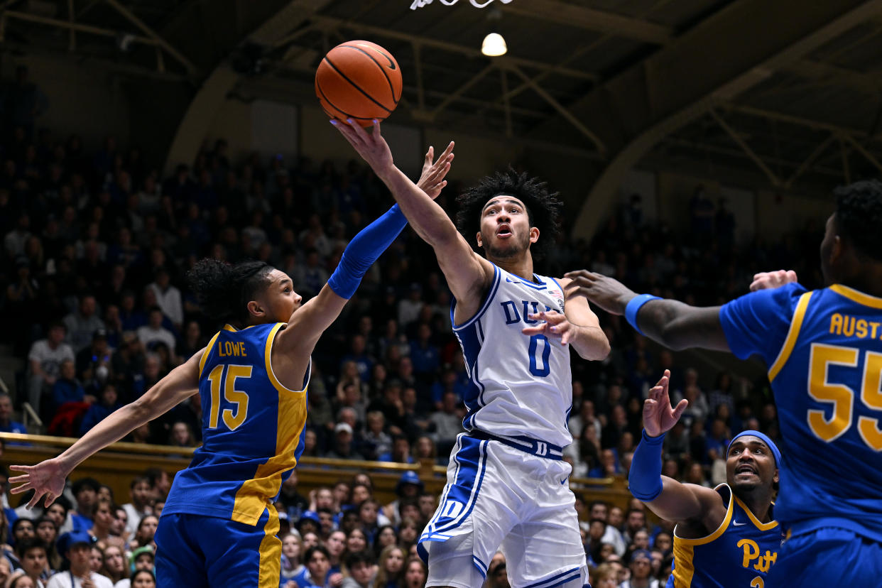 DURHAM, NORTH CAROLINA - JANUARY 20: Jared McCain #0 of the Duke Blue Devils drives to the basket against Jaland Lowe #15 of the Pittsburgh Panthers during the second half of the game at Cameron Indoor Stadium on January 20, 2024 in Durham, North Carolina. The Panthers won 80-76. (Photo by Grant Halverson/Getty Images)