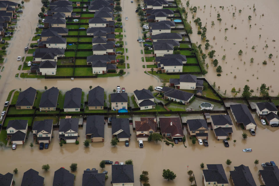 <p>Residential neighborhoods near the Interstate 10 sit in floodwater in the wake of Hurricane Harvey on August 29, 2017 in Houston, Texas. (Photo: Marcus Yam / Los Angeles Times via Getty Images) </p>