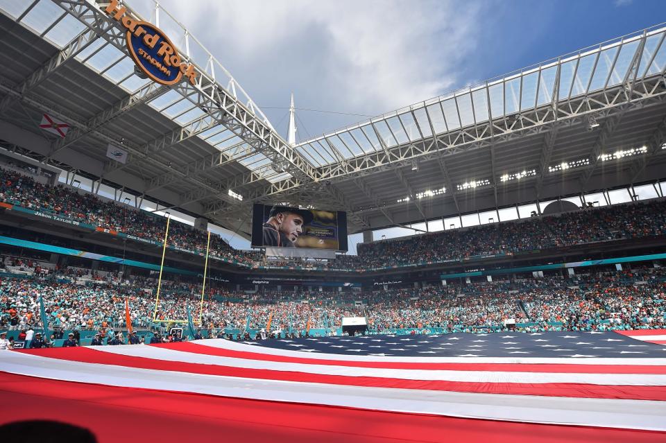 <p>A moment of silence is observed for Miami Marlins pitcher Jose Fernandez pictured on the video board who was killed Sunday morning in a boating accident before the game between the Miami Dolphins and the Cleveland Browns at Hard Rock Stadium. Mandatory Credit: Jasen Vinlove-USA TODAY Sports </p>