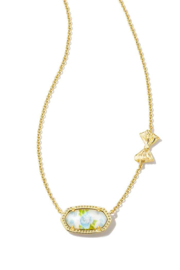 gold kendra scott necklace with blue floral