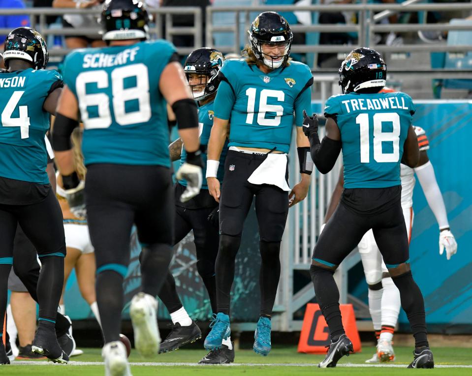 Jacksonville Jaguars quarterback Trevor Lawrence (16) celebrates with teammates after throwing a touchdown pass to tight end Evan Engram (17) during during early second quarter action. The Jacksonville Jaguars hosted the Cleveland Browns at TIAA Bank Field in Jacksonville, Florida Friday, August 12, 2022 for the first home preseason game of the season. [Bob Self/Florida Times-Union]