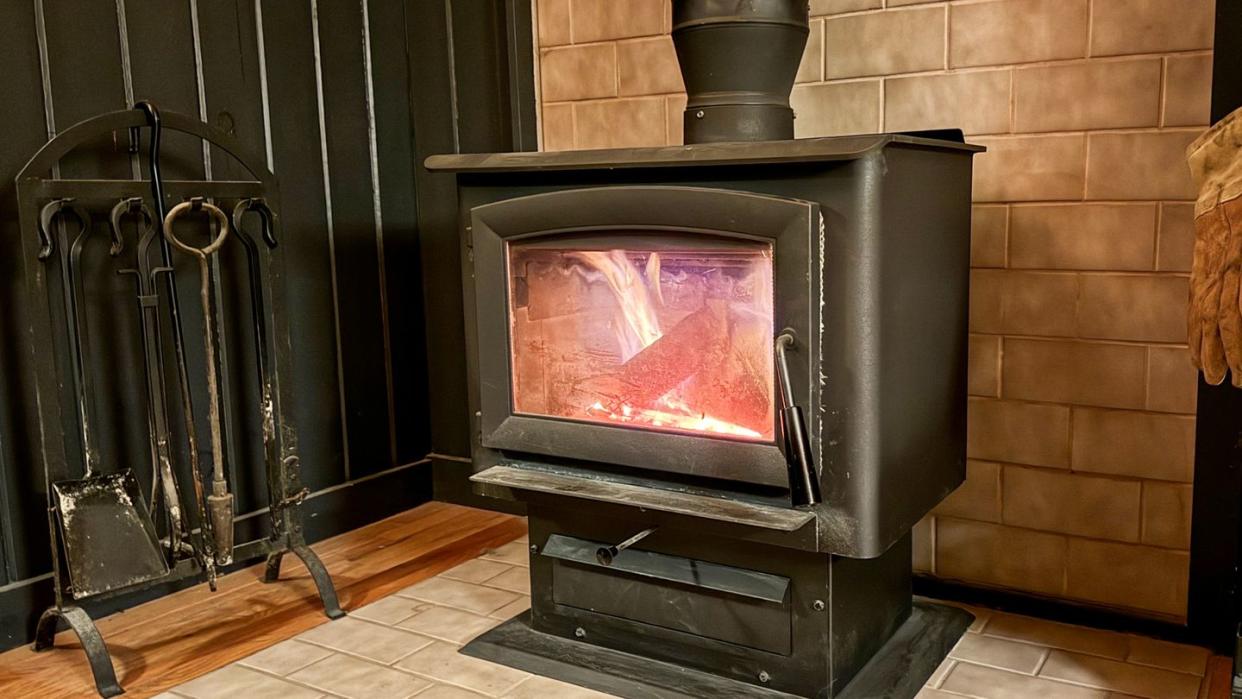 a wood stove with a fire in it