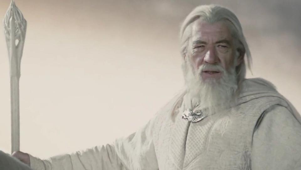 Ian McKellen as Gandalf the White on horseback with his staff