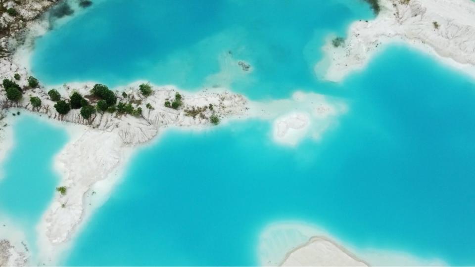 Overhead view of Bangka and Belitung's brightly colored toxic lakes.