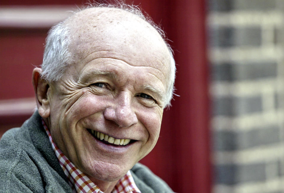 FILE - This May 14, 2006 file photo shows Tony Award winning playwright Terrence McNally in front of the Philadelphia Theater Company in Philadelphia. McNally, one of America’s great playwrights whose prolific career included winning Tony Awards for the plays "Love! Valour! Compassion!" and "Master Class" and the musicals "Ragtime" and "Kiss of the Spider Woman," died Tuesday, March 24, 2020, of complications from the coronavirus. He was 81. (AP Photo/H. Rumph Jr)