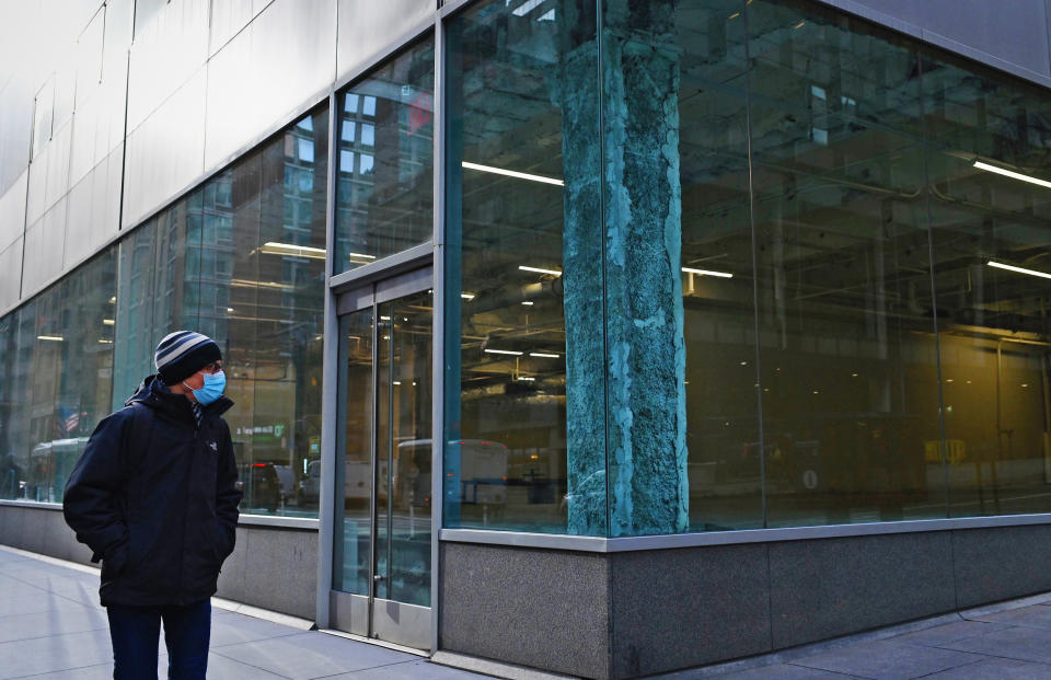 A man walks past an empty office building in the midtown area of Manhattan on Jan. 25, 2021. (Angela Weiss / AFP via Getty Images)