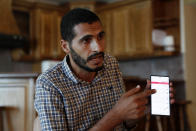 Palestinian journalist Hassan Slaieh shows his blocked Facebook page during an interview in Gaza City, Monday, Oct. 18, 2021. A hashtag for one of Islam's holiest sites is banned, scores of Palestinian journalist accounts are blocked, and the archives of the Syrian civil war have disappeared. A vast vocabulary of common words are off-limits to speakers of Arabic, Facebook's third-most popular language with millions of users worldwide. (AP Photo/Adel Hana)