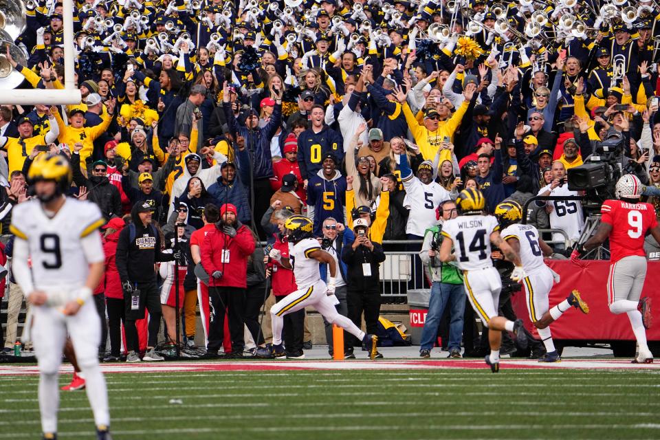 Nov 26, 2022; Columbus, Ohio, USA; Michigan Wolverines running back Donovan Edwards (7) scores a touchdown during the second half of the NCAA football game against the Ohio State Buckeyes at Ohio Stadium. Ohio State lost 45-23. Mandatory Credit: Adam Cairns-The Columbus Dispatch