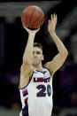 Liberty's Keegan McDowell puts up a shot during the second half of an NCAA college basketball game against South Carolina Saturday, Nov. 28, 2020, at the T-Mobile Center in Kansas City, Mo. (AP Photo/Charlie Riedel)