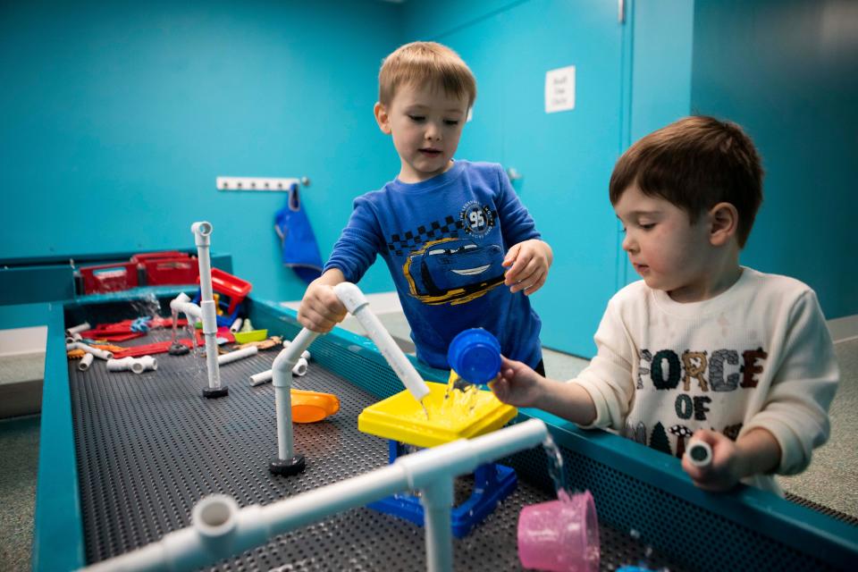 Jude Coolidge (right), 3, and Tilian Welch, 5 and both of Lancaster, play in the water table area at AHA! A Hands-On Adventure A Children's Museum on Feb. 2, 2023 in Lancaster, Ohio.