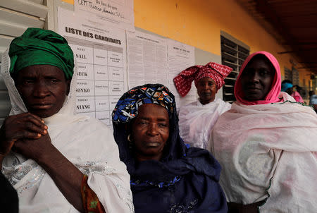 People wait to cast their vote during presidential election, at a polling station in Fatick, Senegal February 24, 2019. REUTERS/Zohra Bensemra