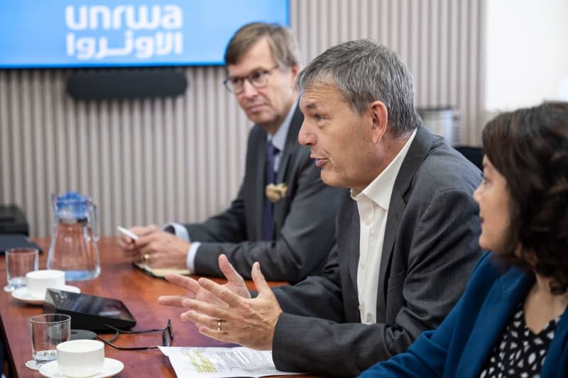 Philippe Lazzarini (2nd R), Commissioner-General of the United Nations Relief and Works Agency for Palestine Refugees in the Near East, speaks during a visit by the German Development Minister to the UNRWA headquarters in Amman. Hannes P Albert/dpa