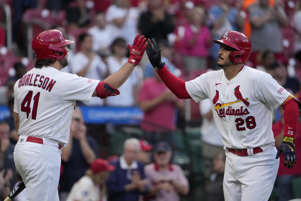 St. Louis Cardinals' Nolan Arenado (28) is congratulated by teammate Alec Burleson after hitting a two-run home run during the first inning of a baseball game against the Oakland Athletics Tuesday, Aug. 15, 2023, in St. Louis. (AP Photo/Jeff Roberson)